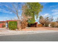 Charming single-story home with mature trees and covered parking at 71 E Atlantic Ave, Henderson, NV 89015