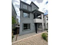 Modern two-story home featuring a stucco exterior, covered porch, and gravel landscaping at 1433 Nocturnal Flight St, Las Vegas, NV 89138