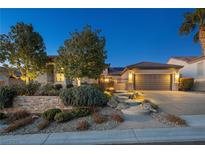 Elegant single-story home with landscaped yard and two-car garage at 2446 Hardin Ridge Dr, Henderson, NV 89052