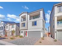 Two-story house with gray siding, red door, and gray garage door at 5566 Erindale Terrace Ave, Las Vegas, NV 89141