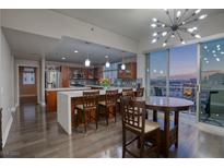 Modern kitchen with stainless steel appliances and breakfast bar at 150 Las Vegas Blvd # 907, Las Vegas, NV 89101