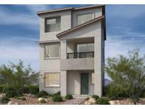 Three-story modern home with balcony and neutral color scheme at 1537 Bat Hawk St, Las Vegas, NV 89138