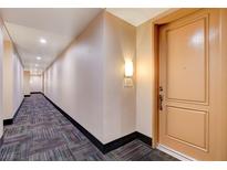 Apartment hallway with carpet and modern apartment door at 27 E Agate Ave # 505, Las Vegas, NV 89123