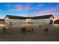 Stunning single-story home with a modern design and landscaped yard at 308 Belfast St, Henderson, NV 89015