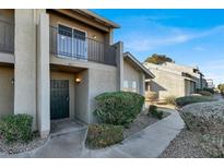 Two story condo building with walkway and landscaping at 451 Sellers Pl, Henderson, NV 89011