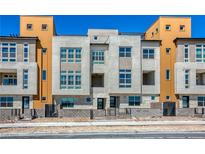 Contemporary three-story townhome with attractive exterior finishes at 650 Sentinel Spire St, Las Vegas, NV 89138