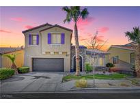 Two-story house with purple shutters, stone accents, and a landscaped yard at 6819 Rolling Boulder St, Las Vegas, NV 89149