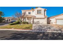 Two-story house with attached garage and landscaped front yard at 7809 Smokerise Ct, Las Vegas, NV 89131