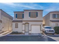 Two-story house with attached garage and landscaping at 1167 Vacation Valley Ave, Las Vegas, NV 89183