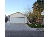 One-story house with a two-car garage and a small front yard at 1574 Teardrop St, Las Vegas, NV 89142