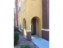 Inviting exterior entrance with arched entryway and well-maintained landscaping at 3975 N Hualapai Way # 157, Las Vegas, NV 89129