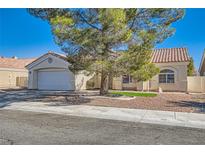 Charming single-story home with well-maintained front yard and attached two-car garage at 5624 Silver Belle St, Las Vegas, NV 89149