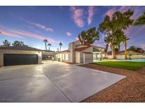 Remodeled home with pool, spa, and detached garage at dusk at 5750 Edna Ave, Las Vegas, NV 89146