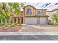 Two-story house with three-car garage and landscaped yard at 7479 Lassen Peak Cir, Las Vegas, NV 89149