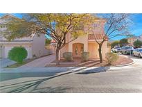 Two-story house with double-door entry and landscaped front yard at 8971 Dallas Ridge Ave, Las Vegas, NV 89178