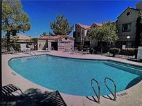 Inviting community pool with surrounding lounge chairs at , Las Vegas, NV 89118