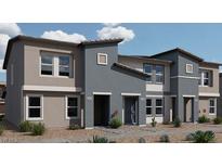 Contemporary tri-level townhome with two-car garage and desert landscaping at , North Las Vegas, NV 89084