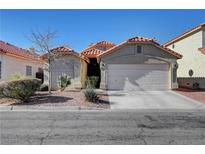 Single-story house with attached garage and desert landscaping at 1109 Sloop Dr, Las Vegas, NV 89128