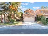 Two-story house with attached garage and landscaped front yard at 2112 Brighton Shore St, Las Vegas, NV 89128