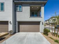 Modern two-story home with attached garage and private balcony at 7322 N Decatur Blvd # 1, Las Vegas, NV 89131