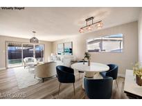 Bright living room with dining area and view into kitchen at 104 Temple Dr, Las Vegas, NV 89107