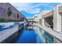 Luxury backyard oasis with a sparkling pool and relaxing patio area at 11903 Sandstone Arch Dr, Las Vegas, NV 89138