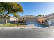 Single-story home with attached garage and landscaped yard at 3514 Old Course St, Las Vegas, NV 89122