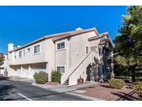 Two-story condo building with attached garages and landscaping at 7450 S Eastern Ave # 2011, Las Vegas, NV 89123