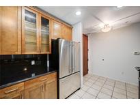 Modern kitchen with stainless steel appliances and wood cabinets at 8255 S Las Vegas Bl Blvd # 718, Las Vegas, NV 89123