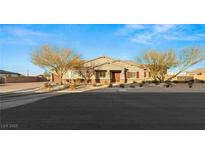 One-story home with a front yard, two-car garage, and neutral color scheme at 1024 San Eduardo Ave, Henderson, NV 89002