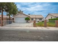 Charming single-story home with a well-maintained front yard and gated entrance at 1905 Rose Coral Ave, Las Vegas, NV 89106