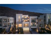 Luxury modern home with city views, multiple levels, and attached garage at 410 Tranquil Peak Ct, Henderson, NV 89012