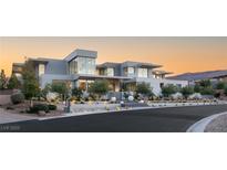 Stunning modern home with clean lines, mature landscaping, and a grand entrance at 14 Magic Stone Ln, Las Vegas, NV 89135