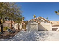 Single-story house with a two-car garage and desert landscaping at 3109 Siena Cir, Las Vegas, NV 89128