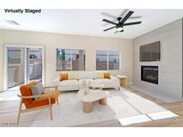 Bright living room with fireplace and access to backyard at 6529 Za Zu Pitts Ave # 102, Las Vegas, NV 89122