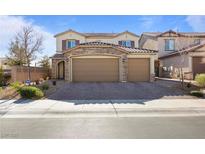 Two-story house with stone accents and a three-car garage at 3957 Little Creek Ave, Las Vegas, NV 89141