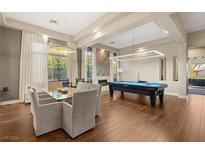 Game room features a pool table, dining table, and hardwood floors at 109 Aventura St, Las Vegas, NV 89144