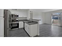 Modern kitchen with stainless steel appliances and gray countertops at 3051 Key Largo Dr # 104, Las Vegas, NV 89120