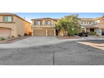 Two-story house with a two-car garage and landscaped front yard at 4029 Treasured Note Ct, Las Vegas, NV 89129