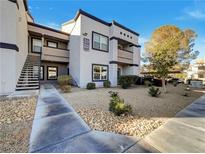 Building exterior showcasing landscaping and walkway at 7255 W Sunset Rd # 1072, Las Vegas, NV 89113