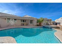 Inviting pool and spa with a large patio at 909 Rhyolite Ter, Henderson, NV 89011