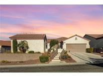 Single-story house with attached garage and landscaped yard at 2356 Weaverville Dr, Henderson, NV 89044