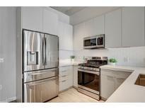 Modern kitchen with stainless steel appliances and white cabinetry at 353 E Bonneville Ave # 457, Las Vegas, NV 89101