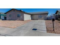 Ranch style home with driveway and landscaping at 4470 Peterson Dr, Las Vegas, NV 89103