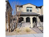 Two-story house with modern facade and landscaped front yard at 11751 Emerald Lake Ave, Las Vegas, NV 89138