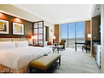 Spacious bedroom with city views and modern decor at 125 E Harmon Ave # 2816, Las Vegas, NV 89109