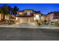 Beautiful two-story house with a three-car garage and landscaped front yard at 1259 Moon Vision St, Henderson, NV 89052