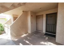 View of the front door with unit numbers 145 and 147 and covered parking area at 3790 Desert Marina Dr # 147, Laughlin, NV 89029