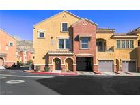 Charming townhome with beautiful archways, garage, and well-maintained landscaping at 3975 N Hualapai Way # 293, Las Vegas, NV 89129