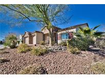 Charming single-story home features a two-car garage and desert landscaping at 5170 Agio Ave, Pahrump, NV 89061